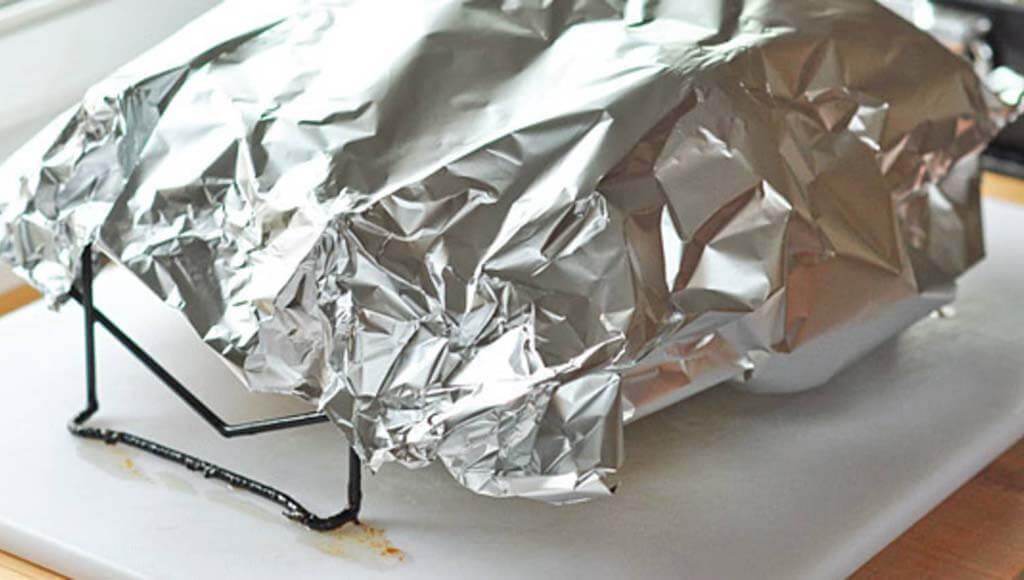 Covering a Turkey With Aluminum Foil