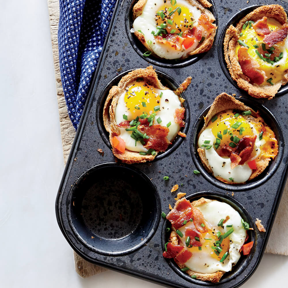 Hard Boiled Eggs In A Muffin Tin With Bacon And Tomatoes