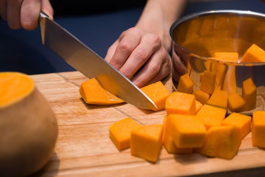 Cut off the top and bottom of the butternut squash with