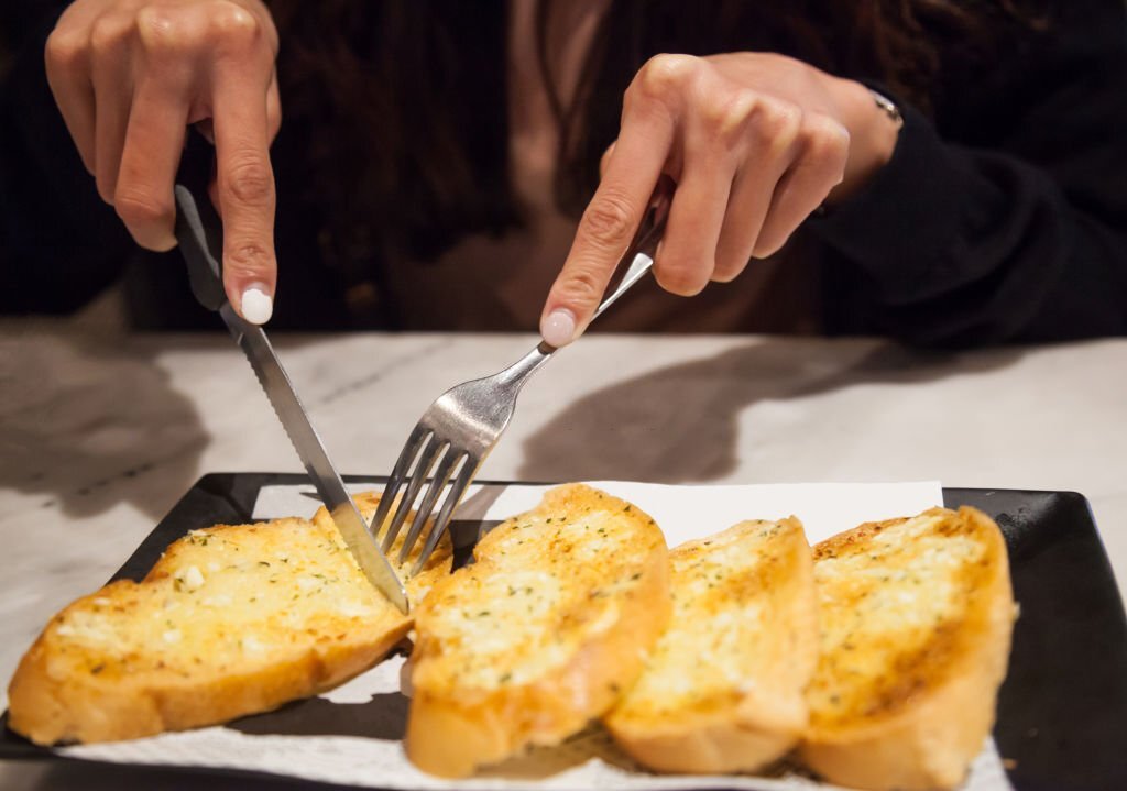 Eating garlic bread