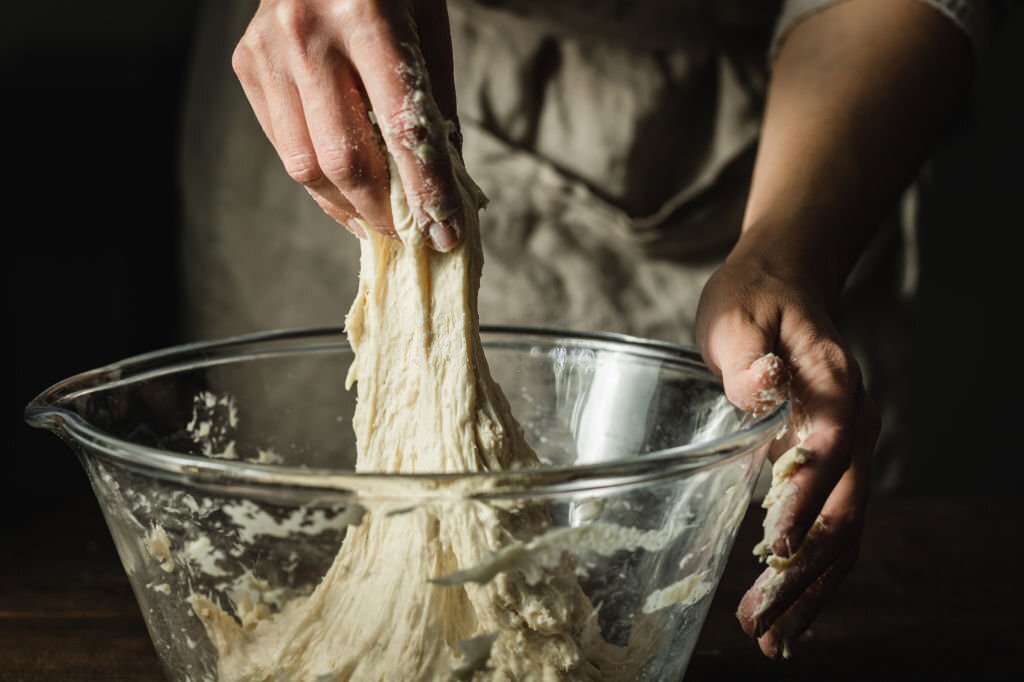 Mixing flour for garlic bread